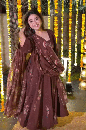 Woman in Brown Traditional Dress at Festive Event
