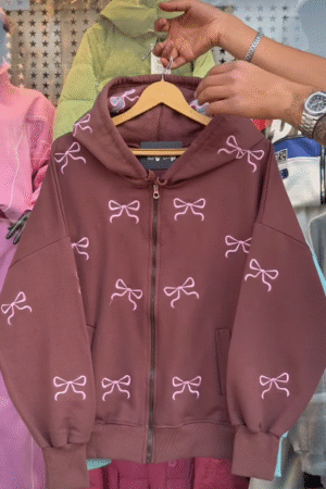 Brown Hoodie with Bow Pattern Display